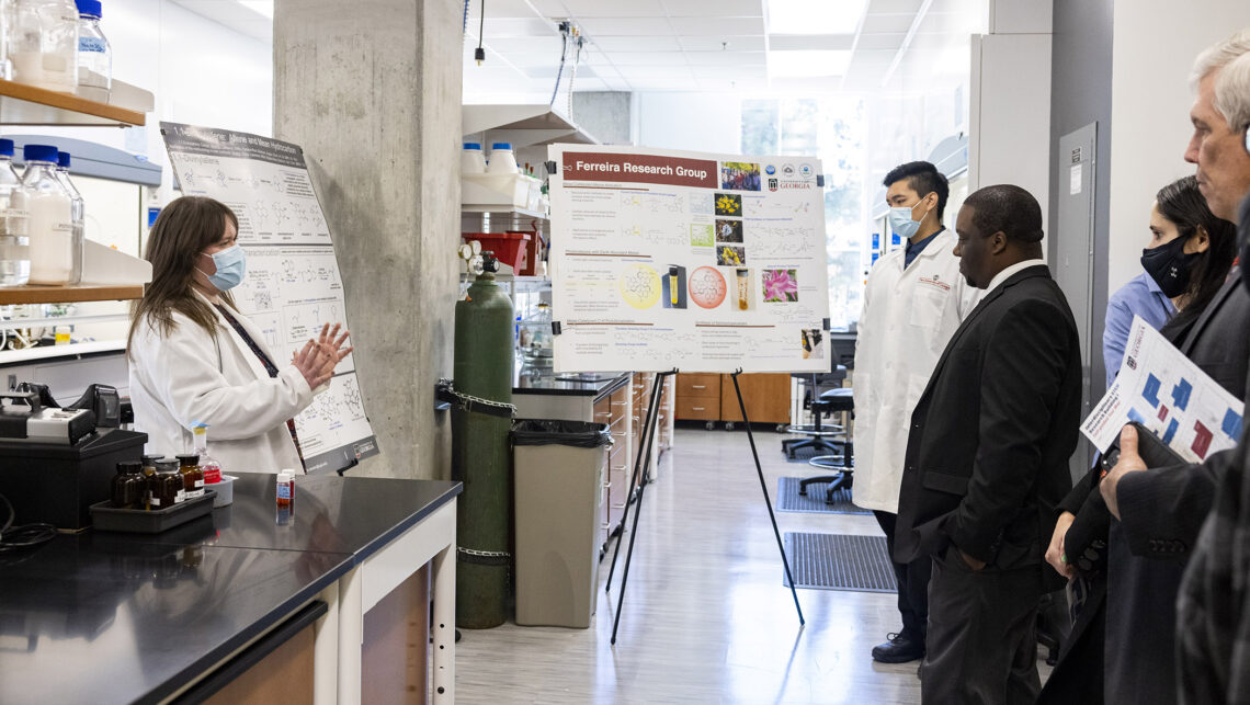 Organic chemistry student Jessica Budwitz talks about her research to attendees during their building tour. (Photo by Dorothy Kozlowski/UGA)