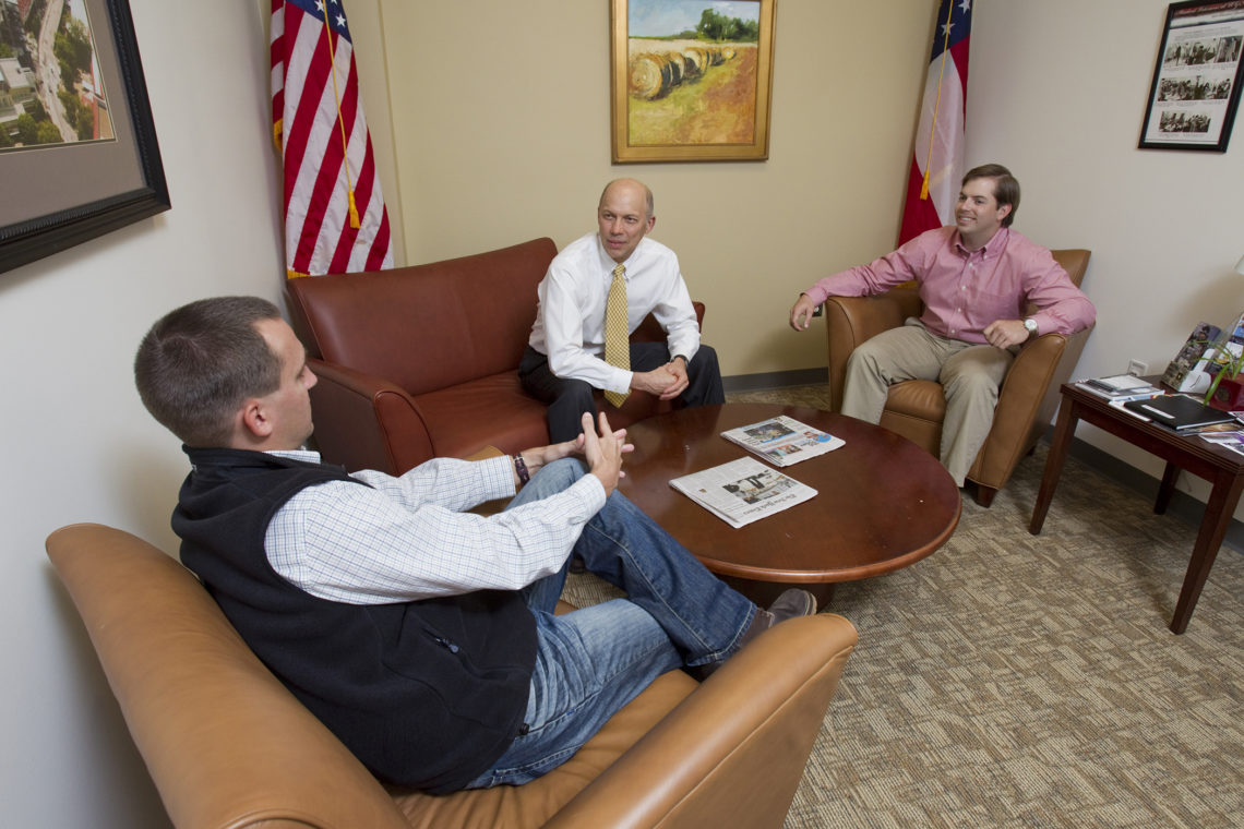 From left, Matt Fowler, a senior majoring in political science; Ted Barco, director of the Student Veterans Resource Center; and Matt Rowenczak, an MBA candidate talk in the lounge of the Student Veterans Resource Center. (UGA file photo from 2013)