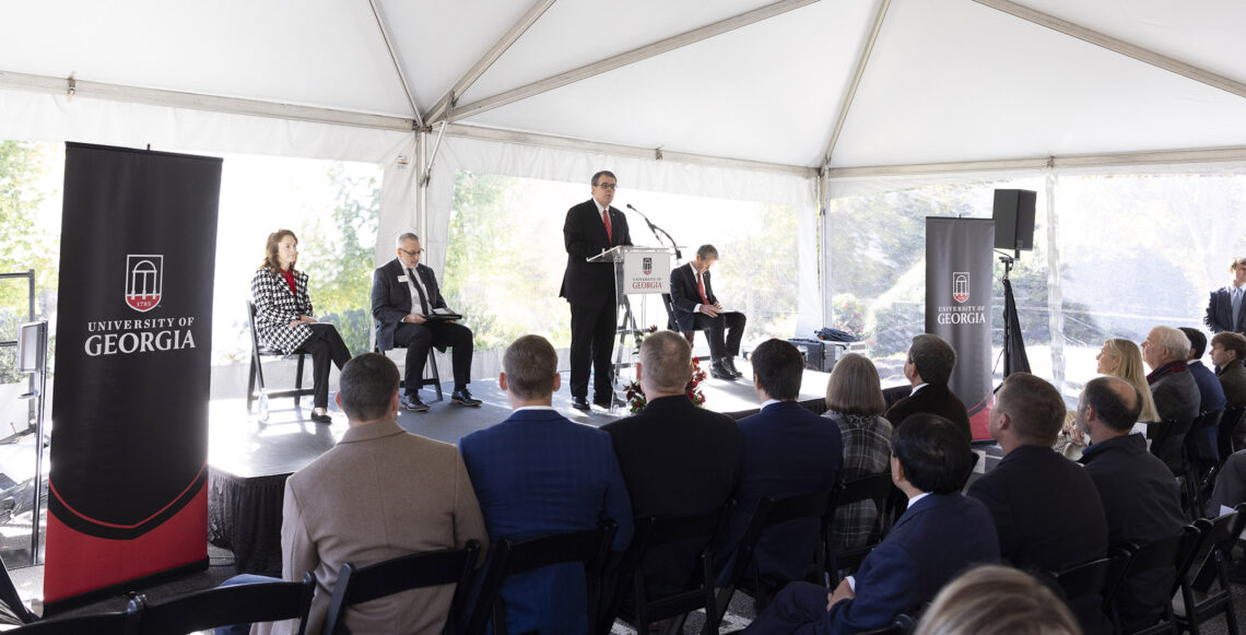 UGA President Jere W. Morehead speaks at the groundbreaking ceremony. With him on the stage are student speaker Kylie Bruce, a poultry science major; Nick Place, dean and director, College of Agricultural and Environmental Sciences; and Gov. Brian Kemp. (Peter Frey/UGA)