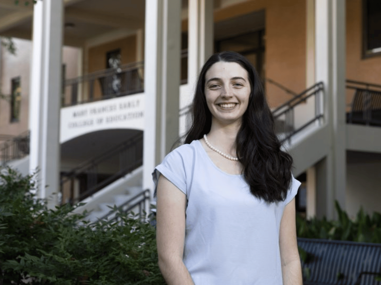 Madison Britt pictured in front of the UGA Mary Frances Early College of Education.