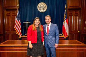 An intern is pictured with Georgia Governor Brian Kemp