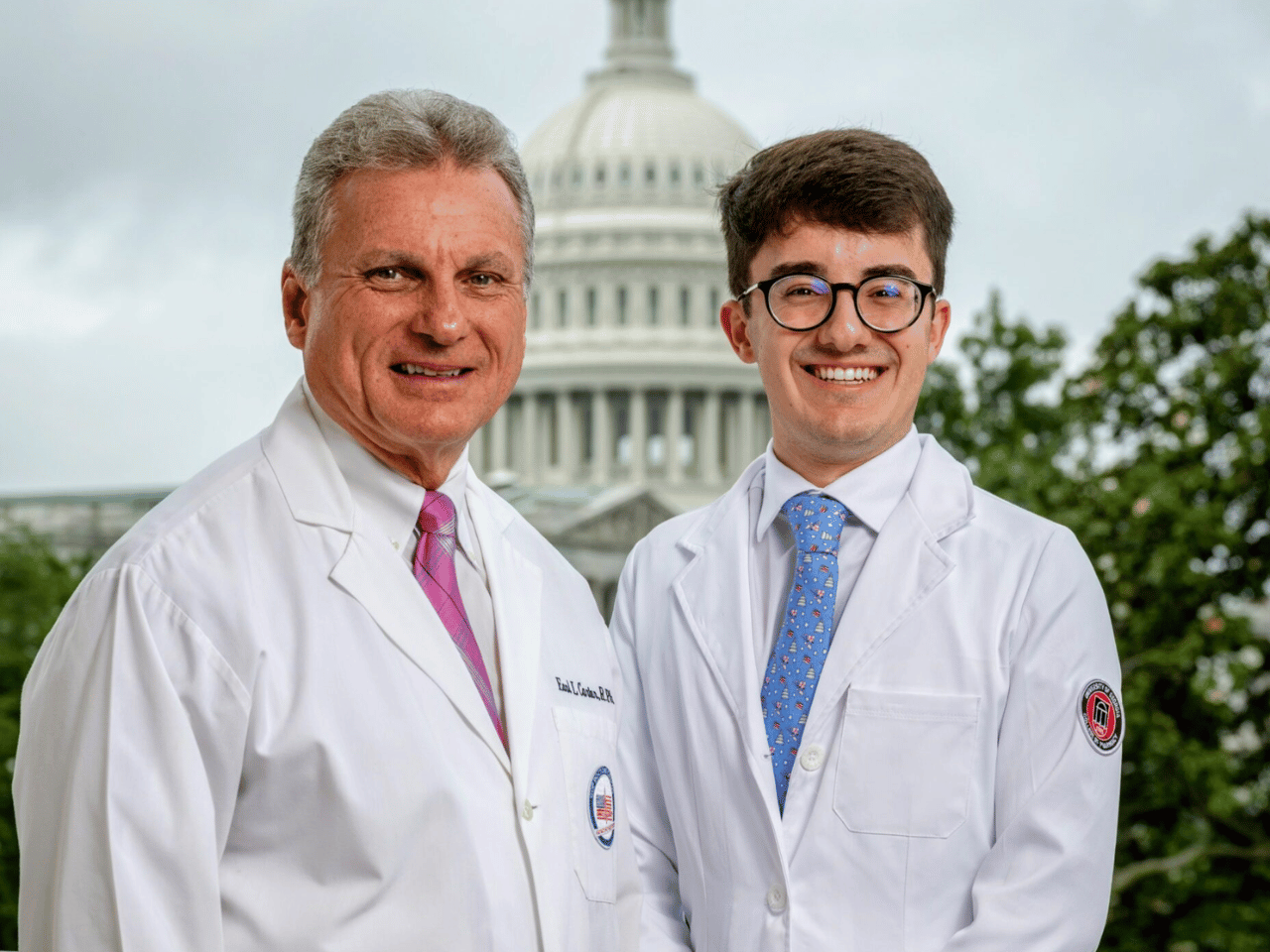 Pharmacist and a UGA pharmacy student take a picture with Capitol Hill in the background.