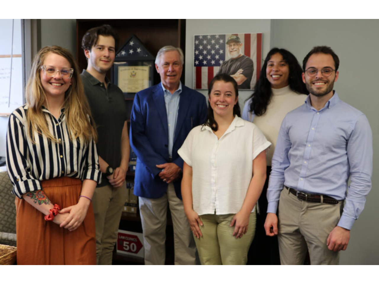 Image of Alumnus Jim Butler (JD ’77) (third from left) with Veterans Legal Clinic participants, from left, third-year students Lindsay Smith and Kyle Nelson, and second-year students Maggie Camfield, Rosalie Vendrell and Ethan Hammond.