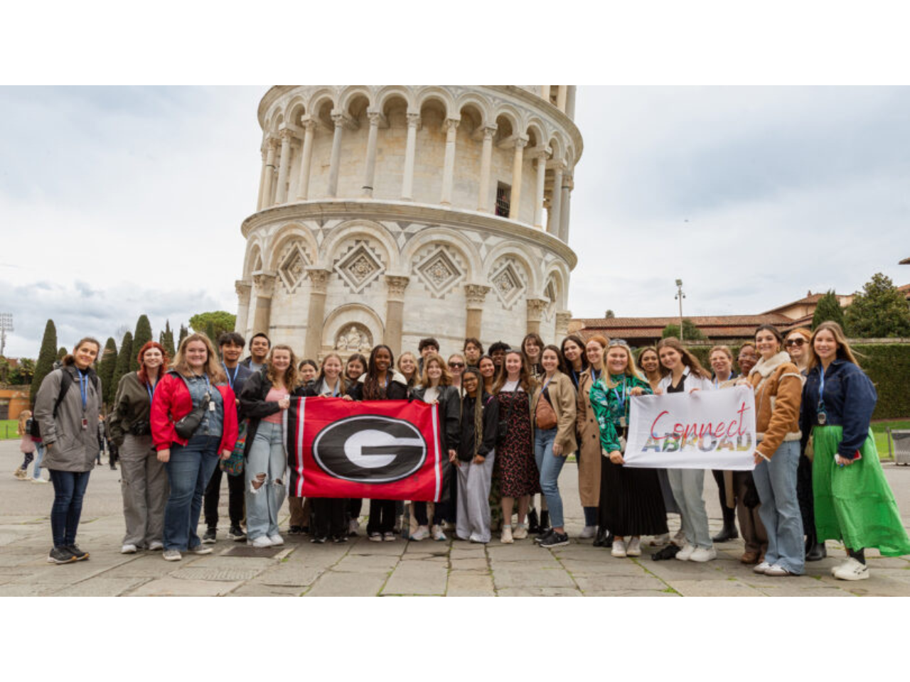 After a hearty climb, Connect Abroad Italy students pose in front of the Leaning Tower of Pisa. (Photo by Angel Bhardwaj)