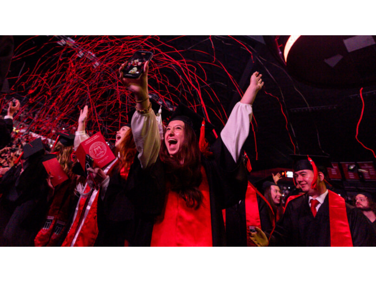 Streamers fall over the crowd during the fall 2024 undergraduate Commencement at Stegeman Coliseum. (Chamberlain Smith/UGA)