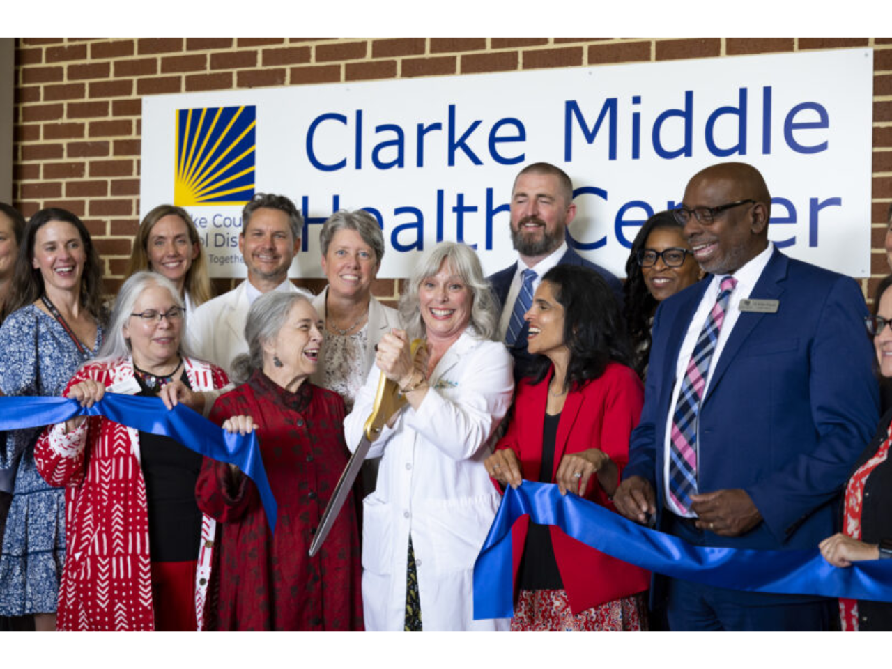 From left to right, College of Family and Consumer Sciences Dean Anisa Zvonkovic, College of Public Health Dean Marsha Davis and Medical Partnership Campus Dean Dr. Shelley Nuss join Medical Director of the Athens Free Clinic and Clarke Middle Health Center Dr. Suzanne Lester as she cuts the ribbon along with School of Law Dean Usha Rodrigues and Clarke County School Superintendent Robbie Hooker at the ribbon cutting ceremony at the Clarke Middle Health Center at Clarke Middle School. (Andrew Davis Tucker/UGA)