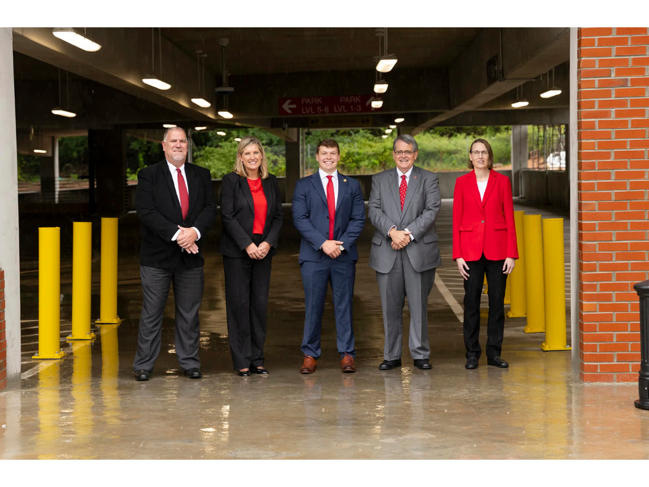 From left, Director of Transportation and Parking Services Todd Berven, Associate Vice President for Auxiliary Services Brett Jackson, former SGA President Rock Rogers, UGA President Jere W. Morehead and Associate Vice President and University Architect Gwynne Darden mark the opening of West Campus Parking Deck II. (Photo by Andrew Davis Tucker/UGA)