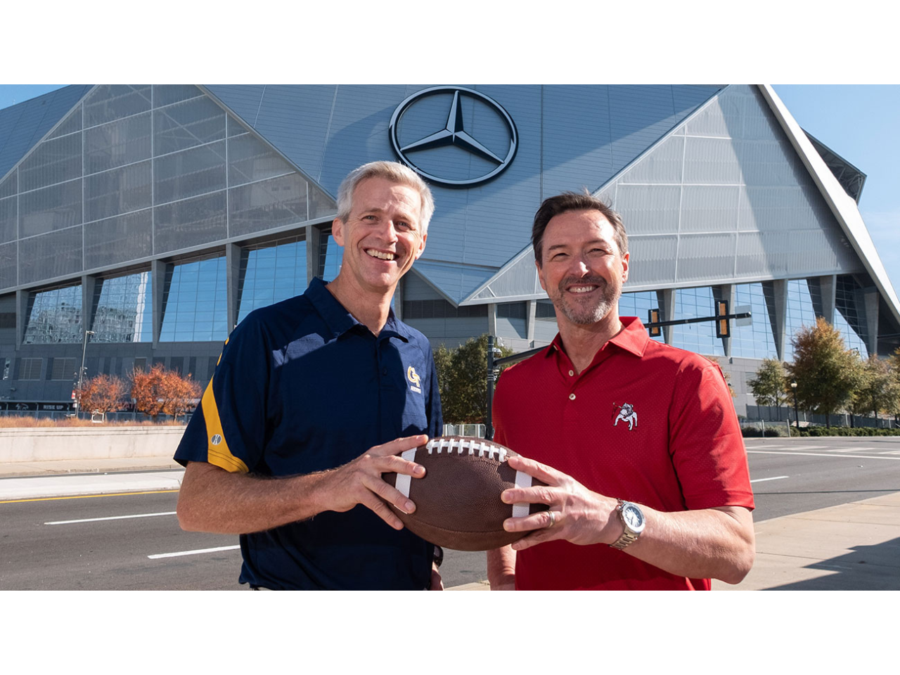 Georgia Tech Executive Vice President for Research Tim Lieuwen and University of Georgia interim Vice President for Research Chris King in front of Mercedes-Benz Stadium.