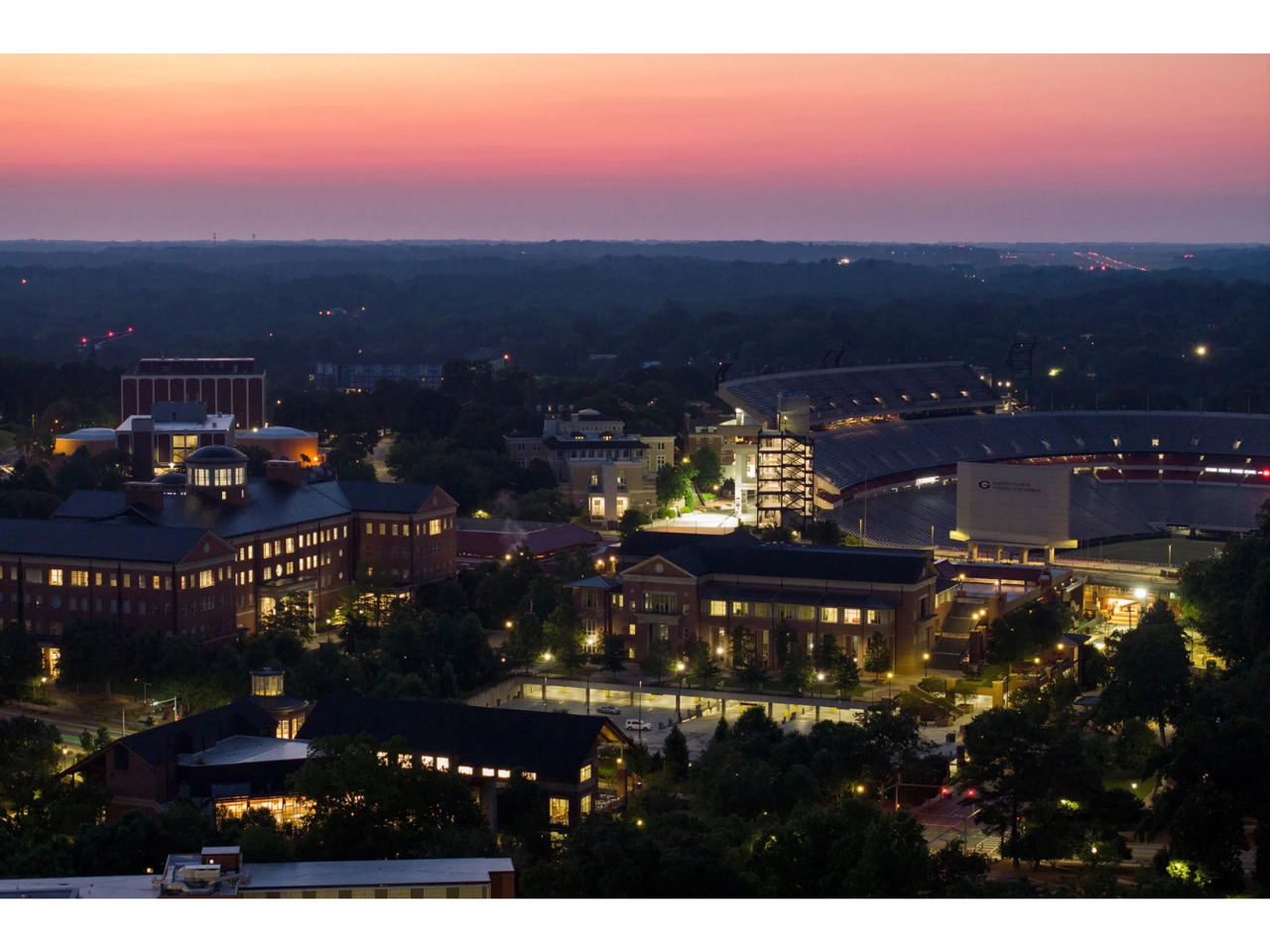 Aerial view of sunrise over UGA’s Central Campus featuring the Bolton Dining Commons, Miller Learning Center, Tate Student Center and Sanford Stadium. (Photo by Andrew Davis Tucker/UGA)